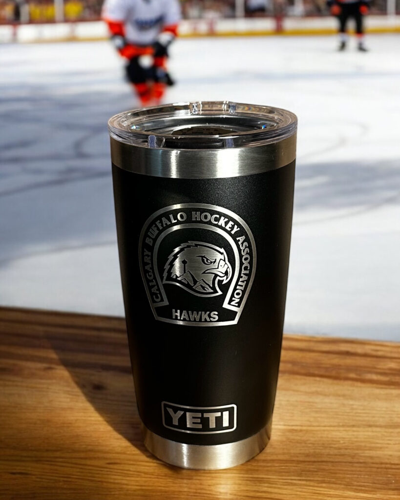 A black yeti mug engraved with the Calgary Buffaloes logo.