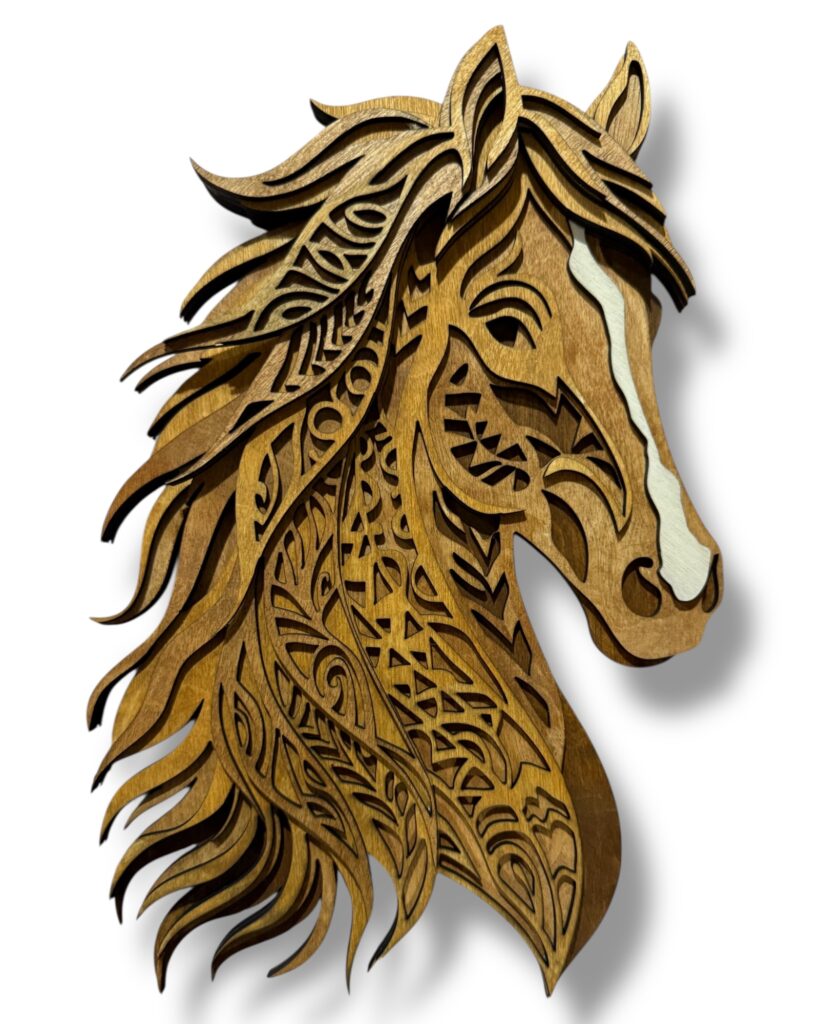 A multi layered wood horse head.